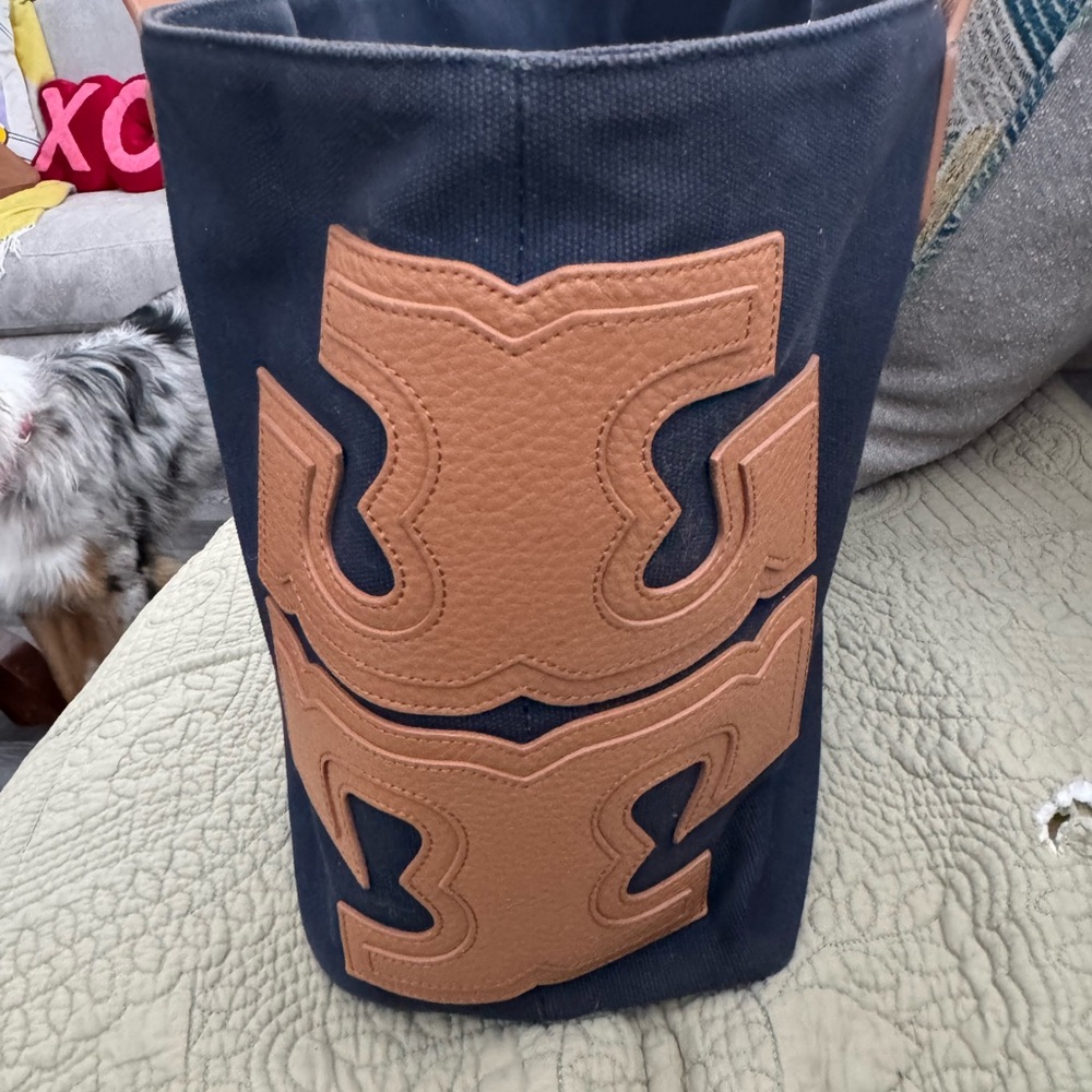 Tory Burch tote bag with emblem on side of bag